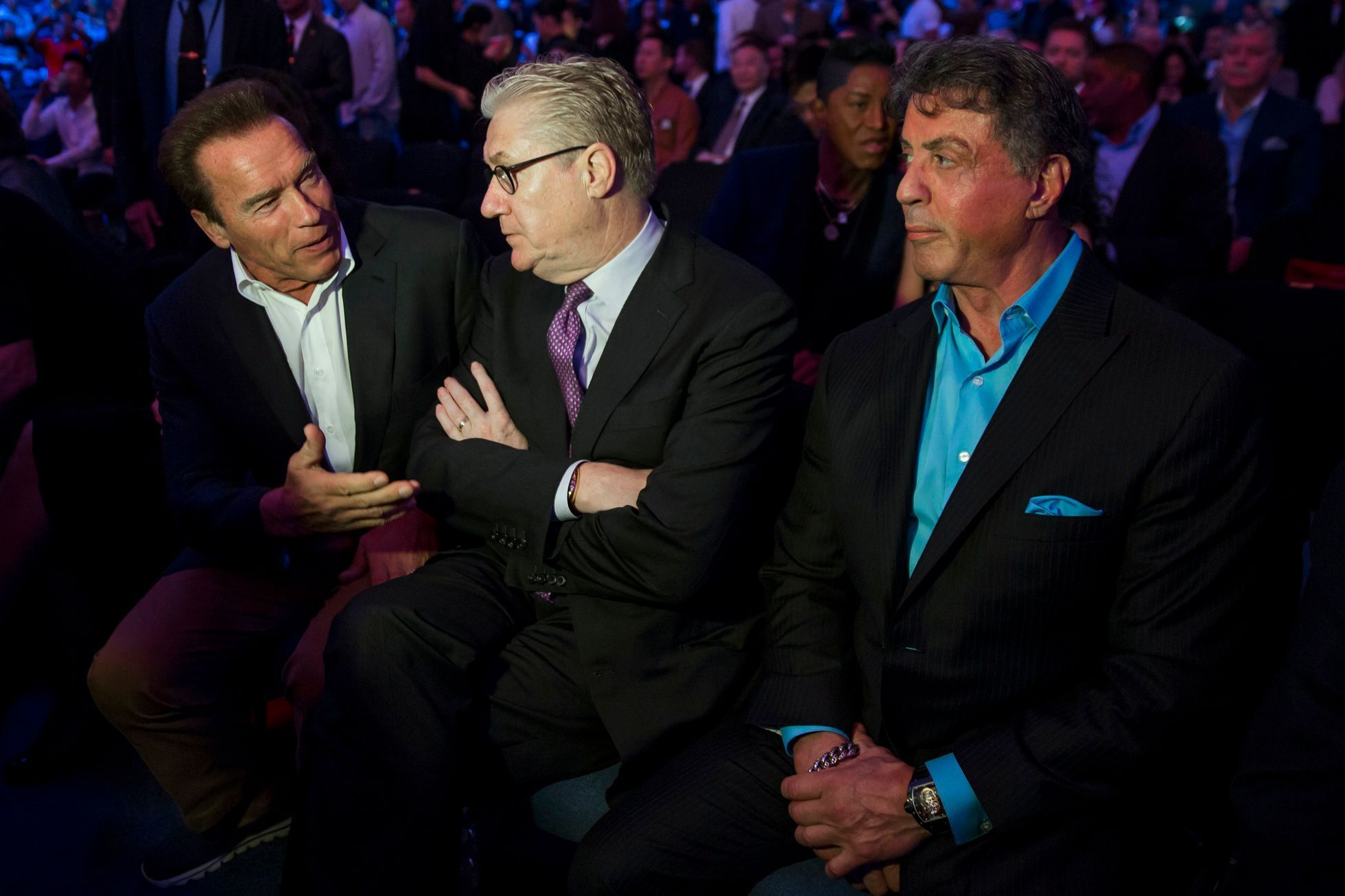 Schwarzenegger, Sands China CEO Tracy, and Stallone attend the WBO world welterweight title boxing match between Pacquiao and Chris Algieri in Macau