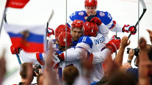 Russia's Sergei Plotnikov (16) celebrates with team mates his goal against Sweden during the first period of their men's ice hockey World Championship semi-final game at