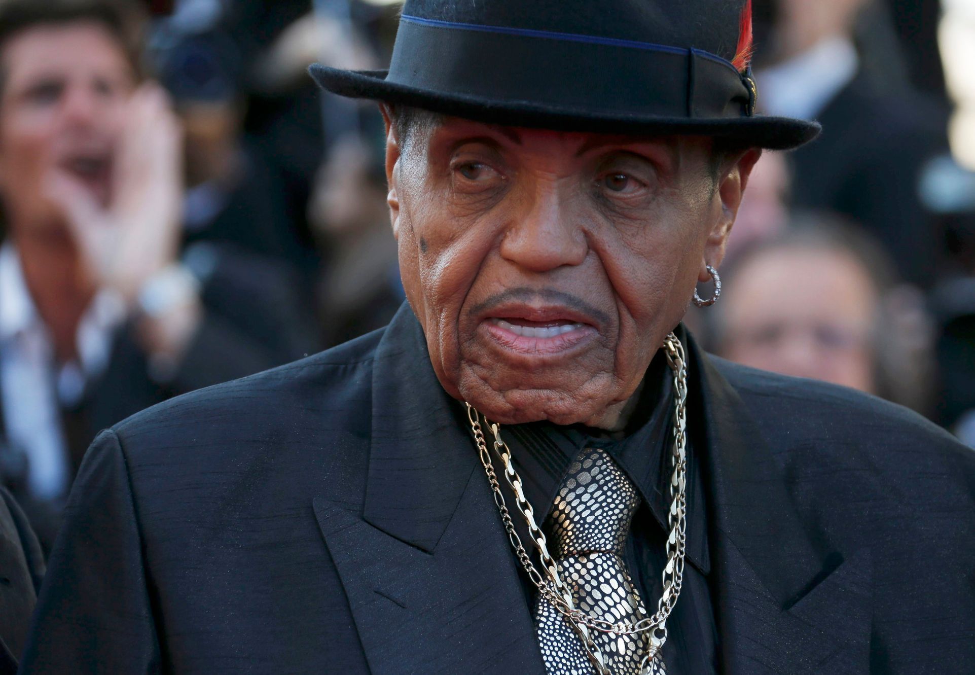 Joe Jackson, father of the late pop star Michael Jackson, poses on the red carpet as he arrives for the screening of the film &quot;Sils Maria&quot; in competition at the 67th Cannes Film Festival in