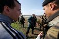 Ukrainian soldiers talk to pro-Russia protesters in the field near Kramatorsk, in eastern Ukraine April 16, 2014.