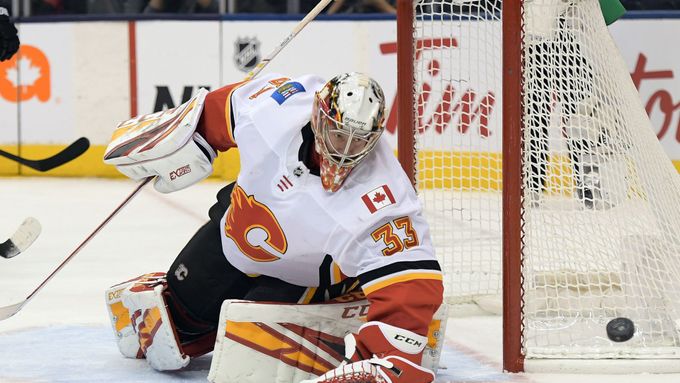 Jan 16, 2020; Toronto, Ontario, CAN;   Calgary Flames goalie David Rittich (33) makes a save against Toronto Maple Leafs in the third period at Scotiabank Arena. Mandator