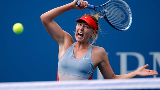 Maria Sharapova of Russia hits a return to Caroline Wozniacki of Denmark during their match at the 2014 U.S. Open tennis tournament in New York