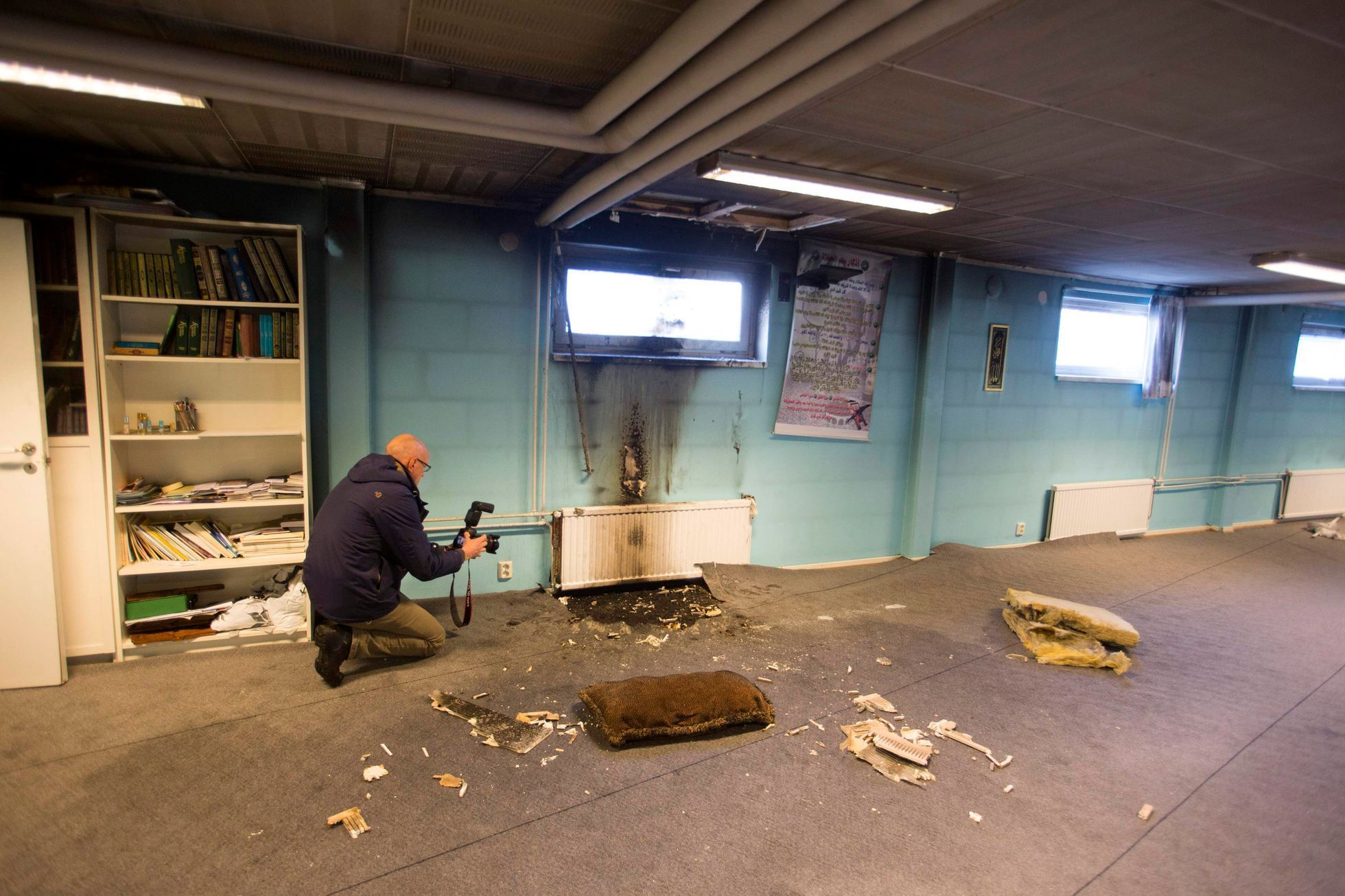 A police officer investigates a suspected arson in the basement of a mosque in the southern Swedish town of Eslov