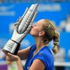 Kvitova of the Czech Republic kisses the trophy after winning the women's singles final match against Bouchard of Canada at the Wuhan Open Tennis Tournament, in Wuhan