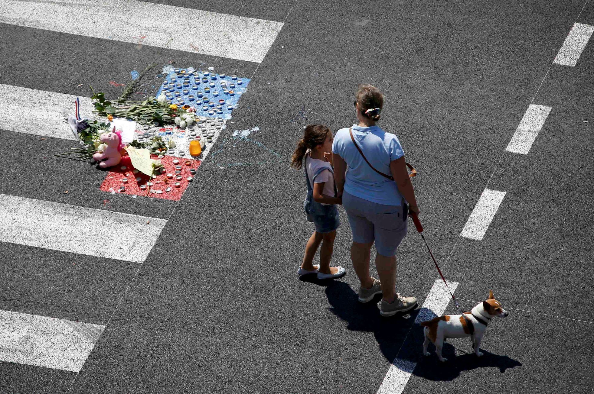 A makeshift memorial placed on the road during a minute of silence in Nice