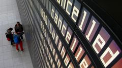 Cancelled flights by German air carrier Lufthansa are pictured on flight schedule board at Munich's airport