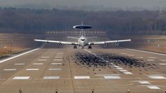 A NATO AWACS aircraft takes-off for a flight to Poland from the AWACS air base in Geilenkirchen