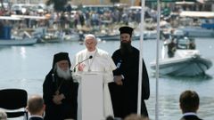 Pope Francis delivers his address at the port of Lesbos during his visit the Greek Island of Lesbos