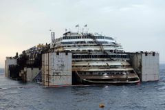The Costa Concordia cruise liner is pictured from a ferry as it emerges during the refloating operation at Giglio harbour July 20, 2014.