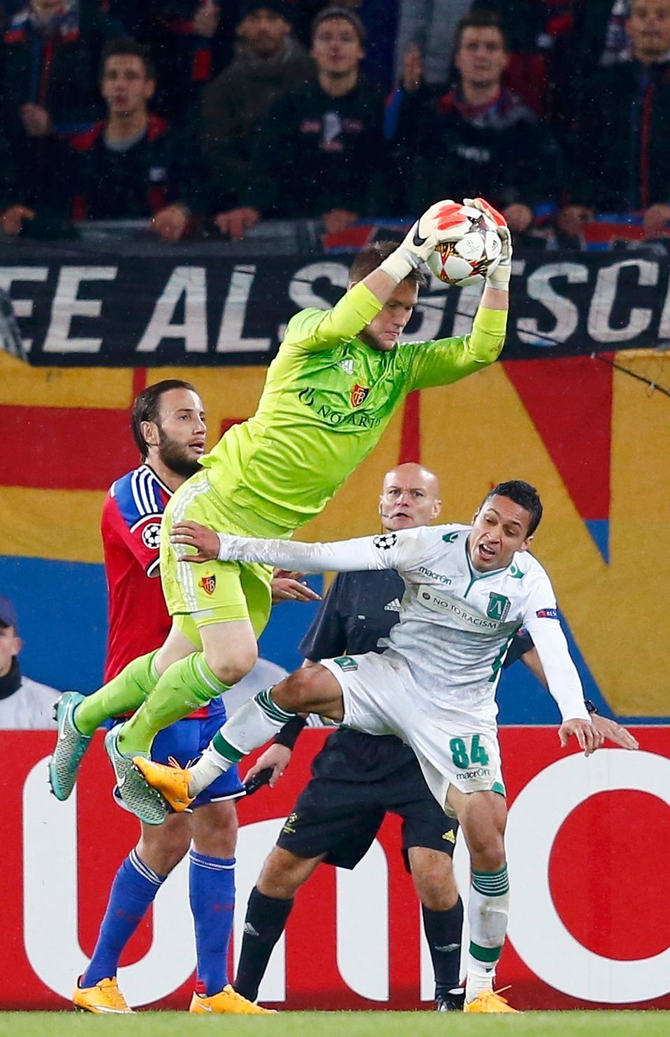 FC Basel's goalkeeper Vaclik saves in front of Marcelinho of Ludogorets during Champions League match in Basel