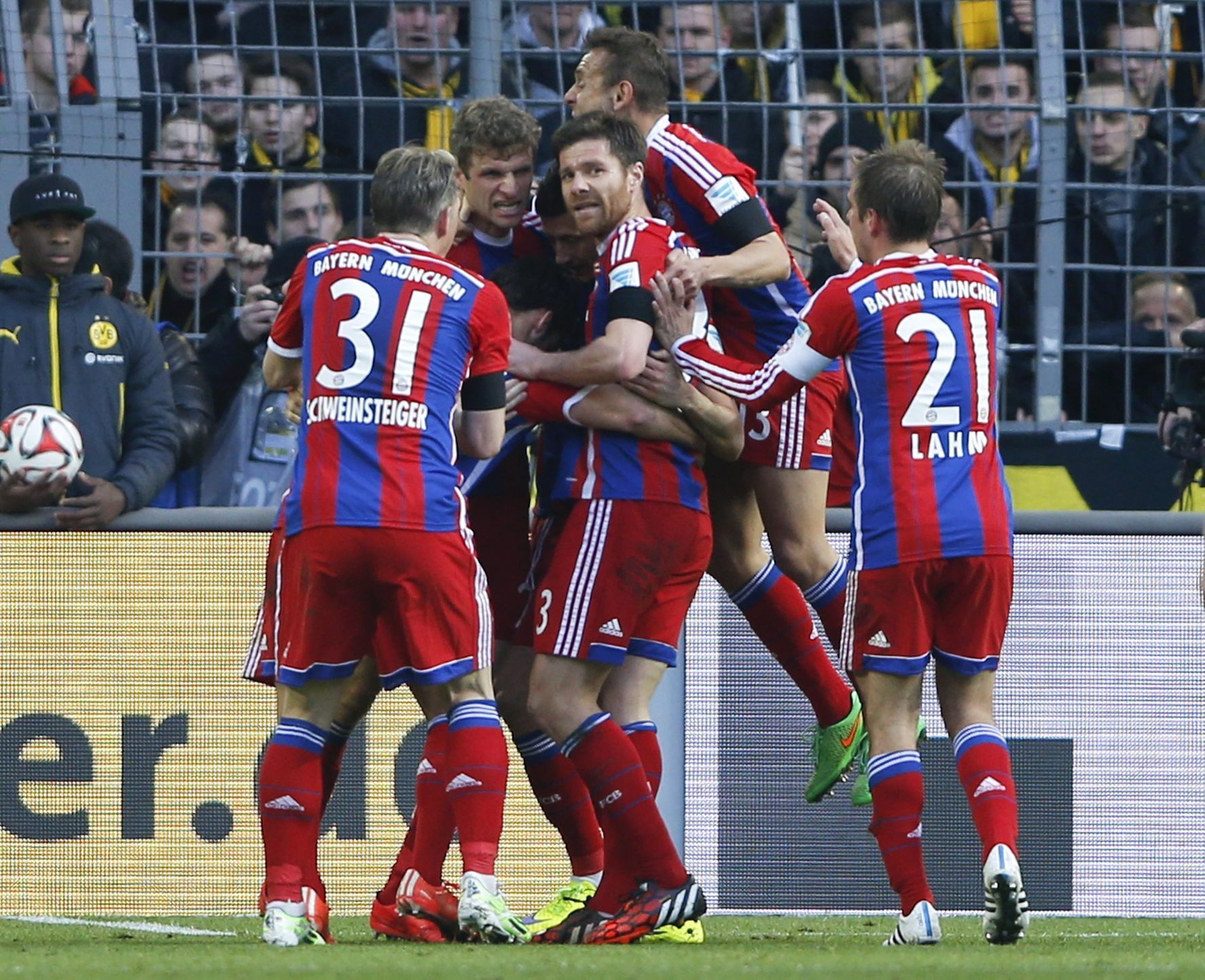 Lewandowski of Bayern Munich celebrates his goal against Borussia Dortmund during their German first division Bundesliga soccer match in Dortmund