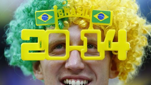 A fan looks on as he waits for the 2014 World Cup opening match between Brazil and Croatia at the Corinthians arena in Sao Paulo June 12, 2014. REUTERS/Damir Sagolj (BRAZ