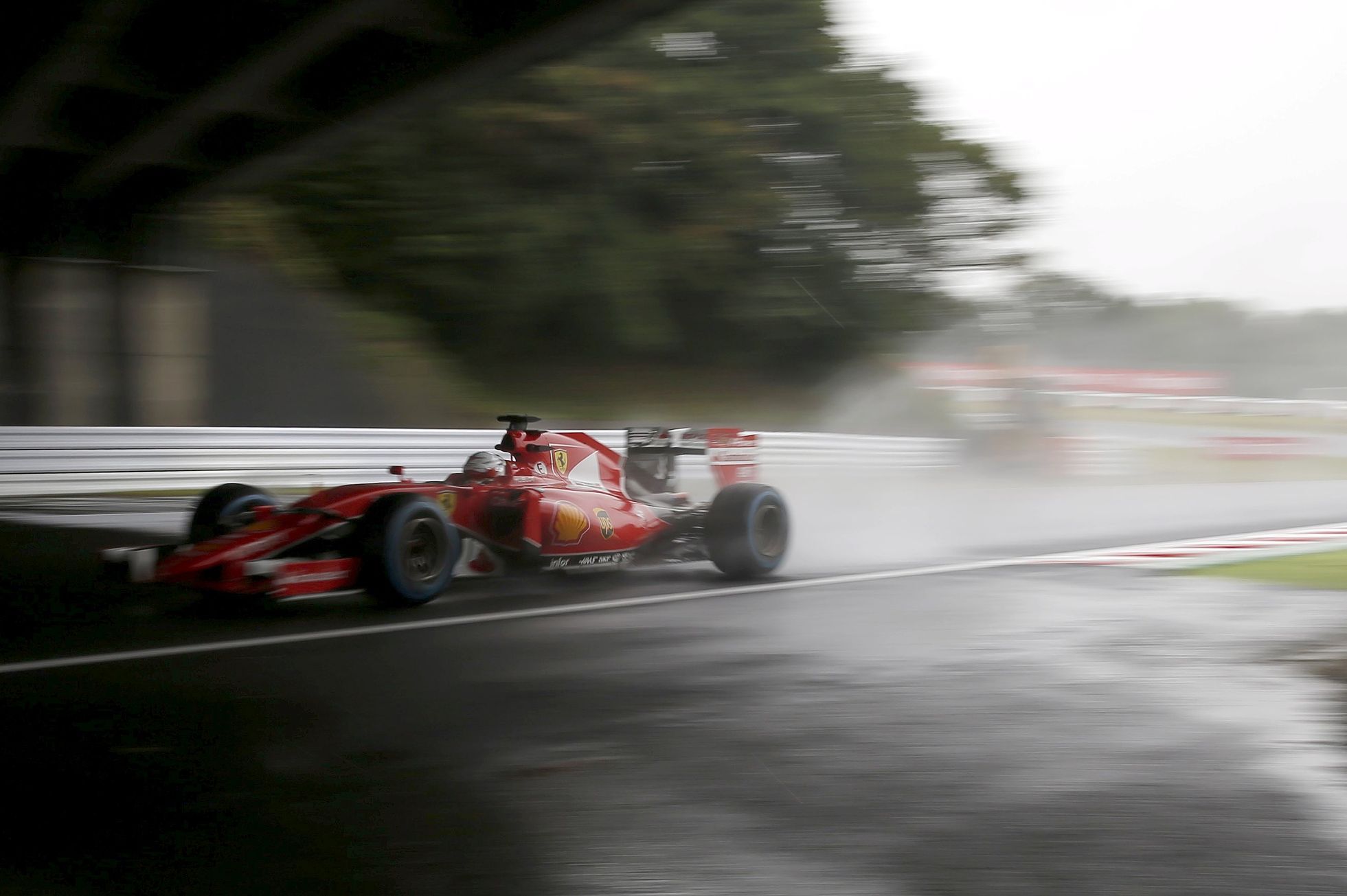 Ferrari Formula One driver Vettel of Germany drives during the second practice session in Suzuka
