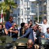 Cast members Sylvester Stallone, Mel Gibson, Jason Statham, Harrison Ford, Arnold Schwarzenegger and Antonio Banderas  pose on a tank as they arrive on the Croisette to promote the film &quot;The Expe