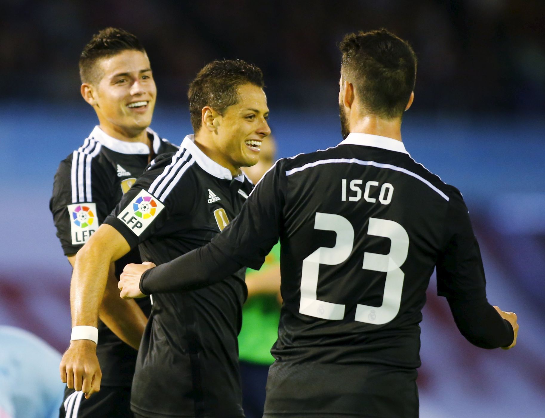 Real Madrid's James celebrates his goal against Celta Vigo with teammates Chicharito and Isco during their Spanish first division soccer match at Balaidos stadium in Vigo