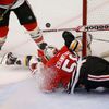 Bruins' Paille collides with Blackhawks goalie Crawford duri