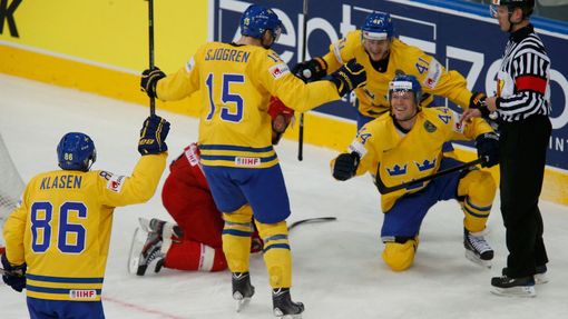 Sweden's Nicklas Danielsson (R) celebrates his goal against Belarus during the first period of their men's ice hockey World Championship quarter-final game at Minsk Arena