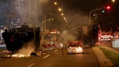 Police officers operate during clashes with anti-government protesters in Belgrade