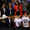 Protesters display slogans on their t-shirts during the men's singles final match between Djokovic of Serbia and Murray of Britain at the Australian Open 2015 tennis tournament in Melbourne