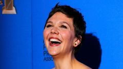 Maggie Gyllenhaal poses with her award during the 72nd Golden Globe Awards in Beverly Hills