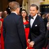 Leonardo DiCaprio greets actor Christoph Waltz on the red carpet at the 86th Academy Awards in Hollywood