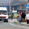 People wrapped in blankets leave the scene of explosions at  Zaventem airport near Brussels, Belgium