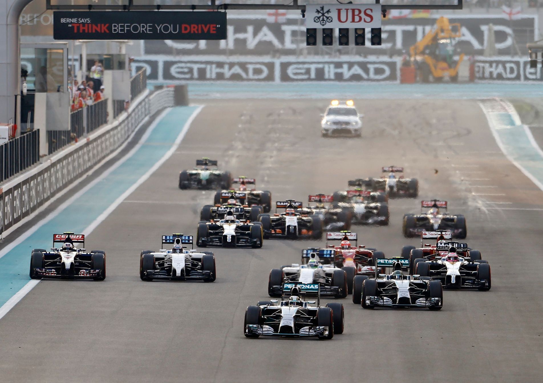 Mercedes Formula One driver Lewis Hamilton of Britain leads the pack as they approach the first turn during the Abu Dhabi F1 Grand Prix at the Yas Marina circuit in Abu Dhabi