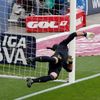 Barcelona's goalkeeper Pinto fails to make the save as Atletico Madrid's Godin scores past him during their Spanish First Division soccer match in Barcelona