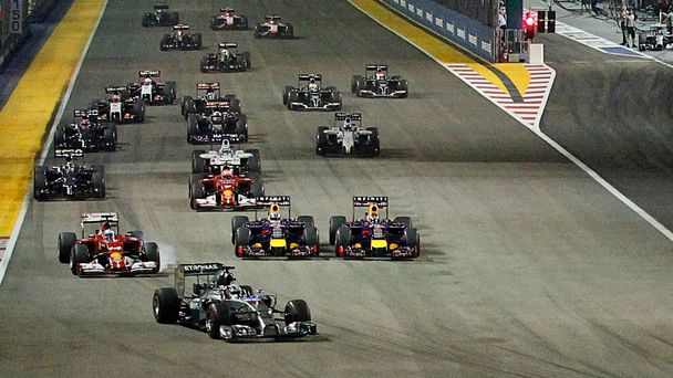 Mercedes Formula One driver Hamilton of leads the pack as team mate Rosberg starts from the pit lane following problems with his car during the Singapore F1 Grand Prix at the Marina Bay street circuit