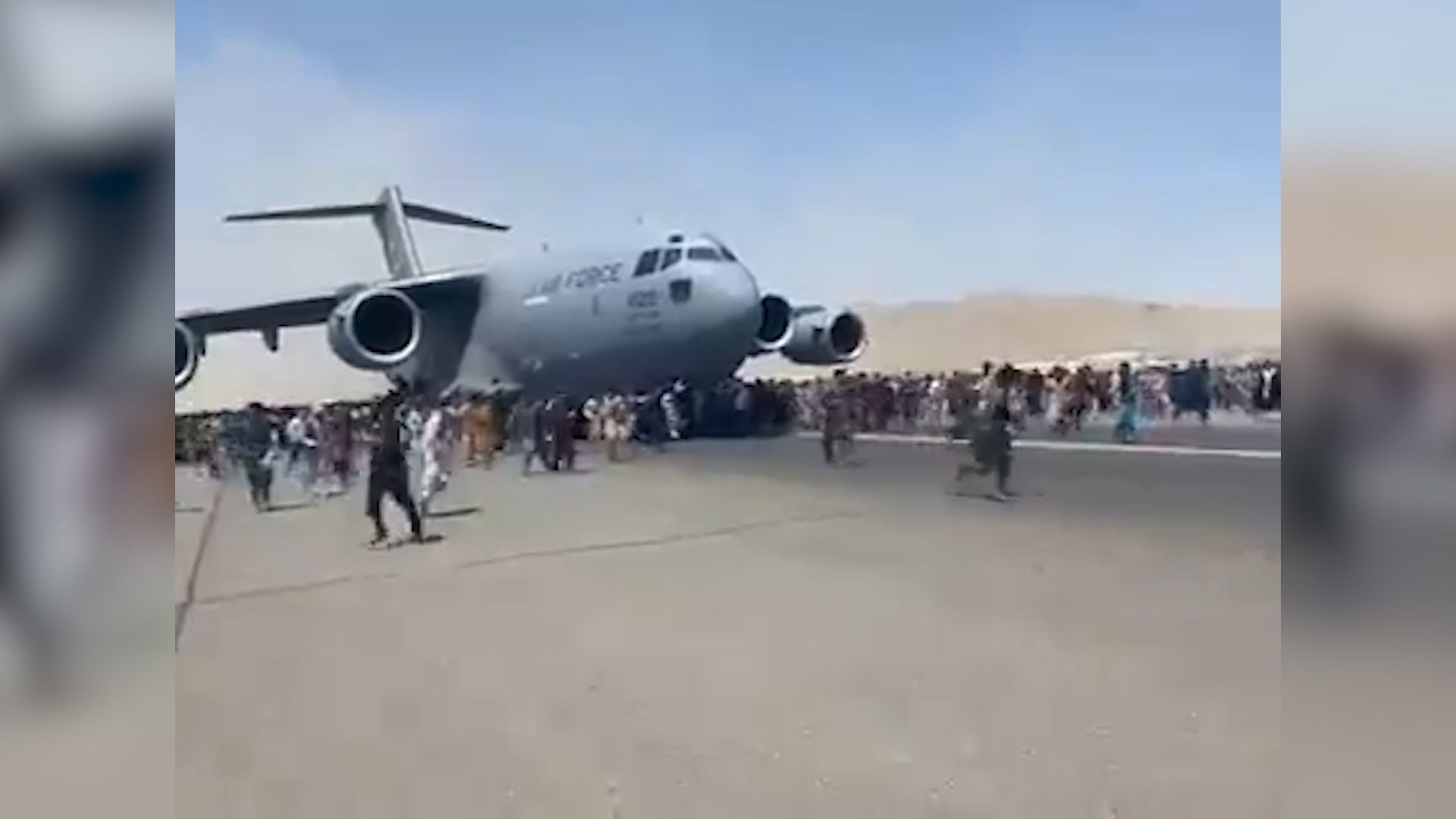 A desperate attempt to escape on the wing of the plane.  Five people have already died at Kabul airport