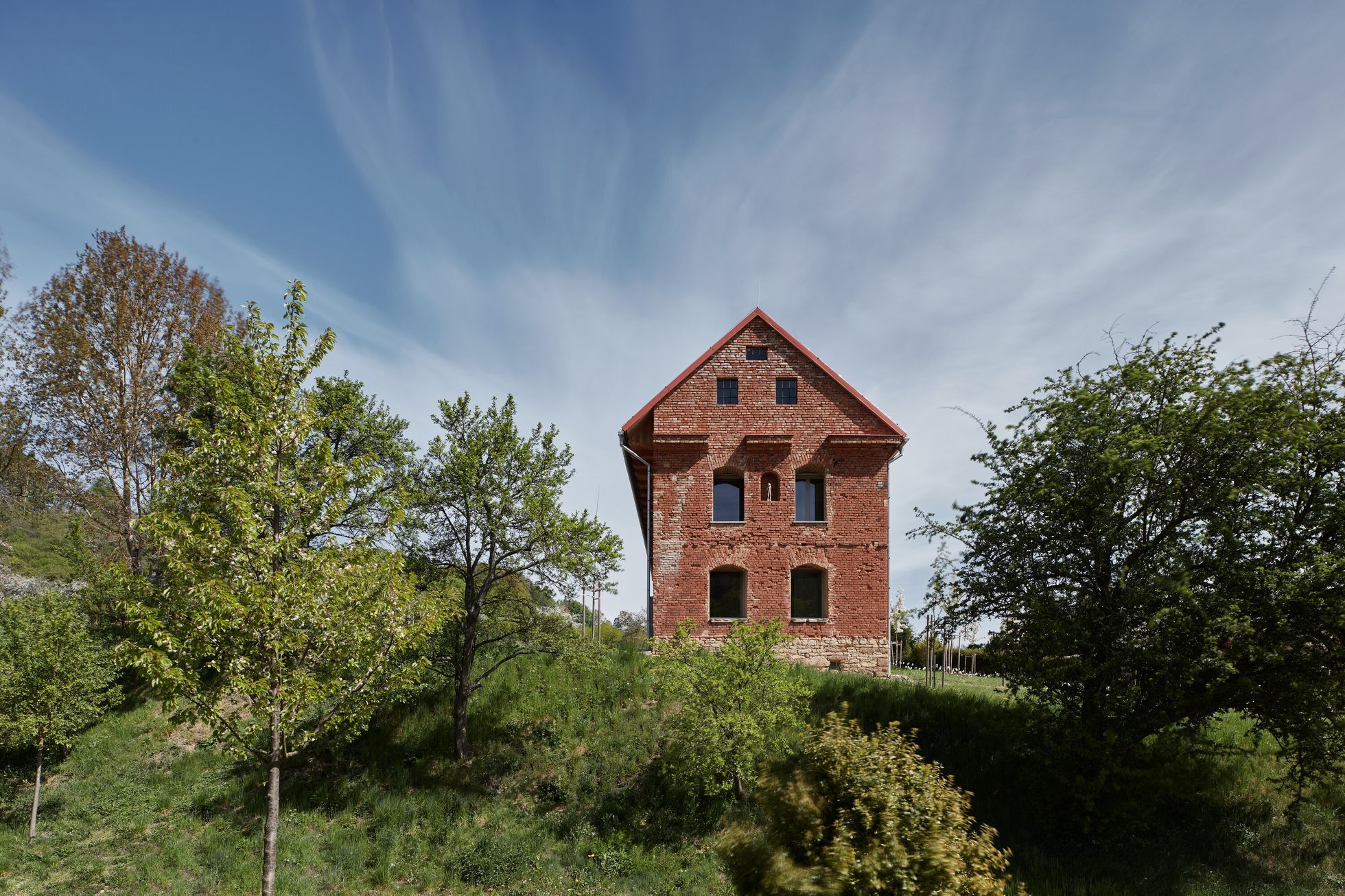 The collective farm rebuilt the homestead into a granary.  The owners have now inserted a new house into the looted ruin