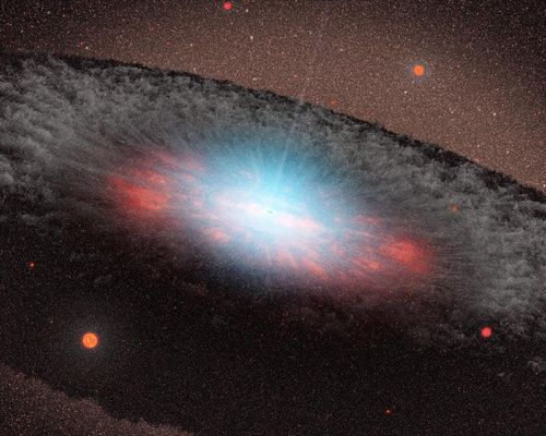 Malířovo zobrazení mohutné černé díry, která leží ve středu naší galaxie. Modrá barva znázorňuje vyzařování hmoty velmi blízko u černé díry. Šedavá struktura obklopující černou díru, zvaná torus, je tvořena plyny a prachem. | Foto: NASA