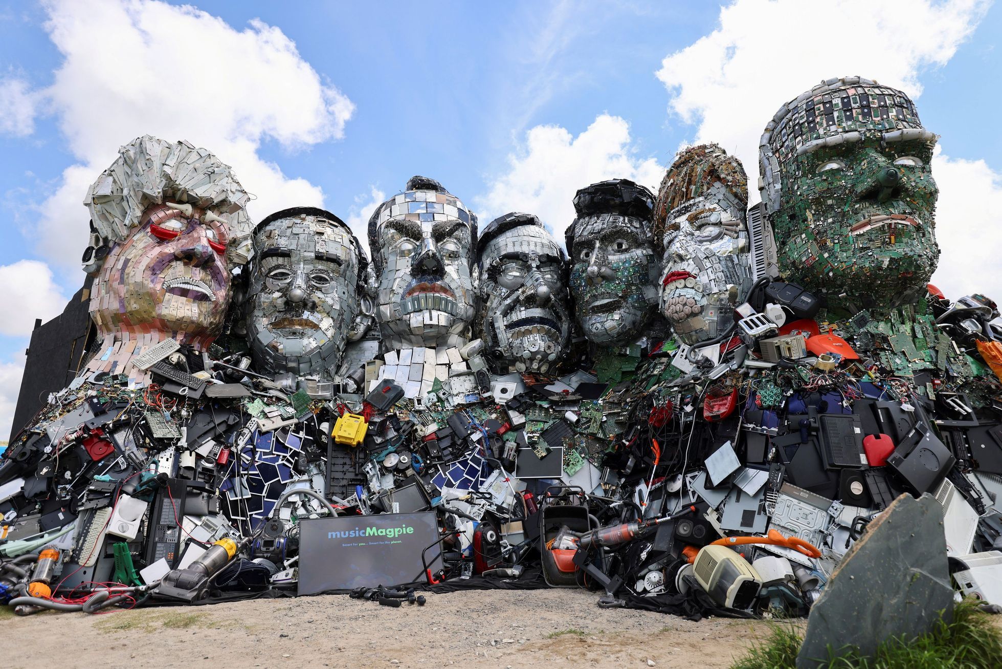 Macron, Biden or Merkel from electrical waste.  The artists created a parody of Mount Rushmore