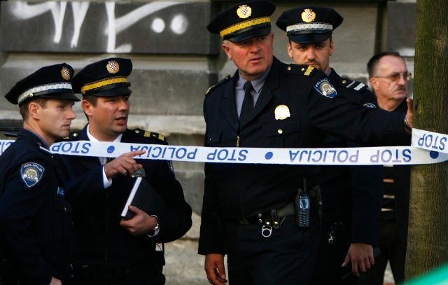 Policie na místě vraždy Hodakové | Foto: Reuters