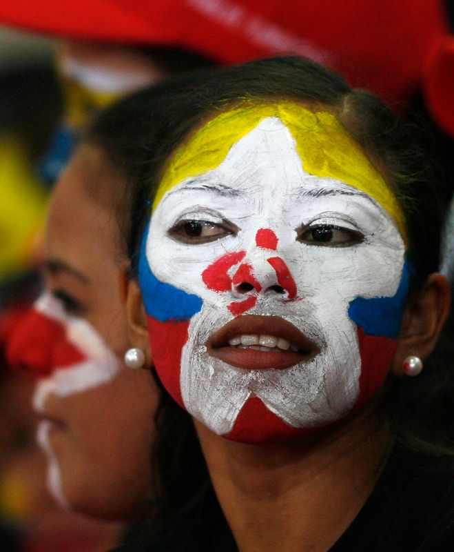 Válečné pomalování původních venezueslkých obyvatelů? Nikoli, jedna z žen podporujících reformu ústavy. | Foto: Reuters