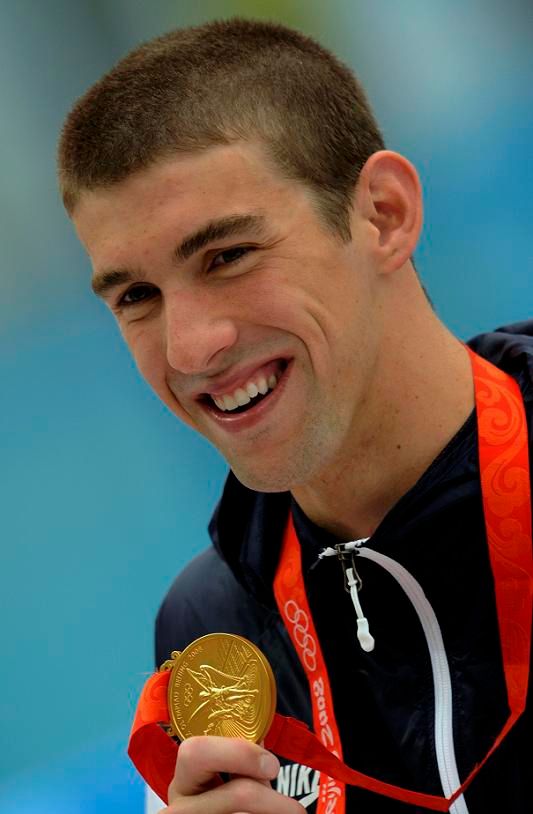 Michael Phelps se třetím zlatem | Foto: Reuters