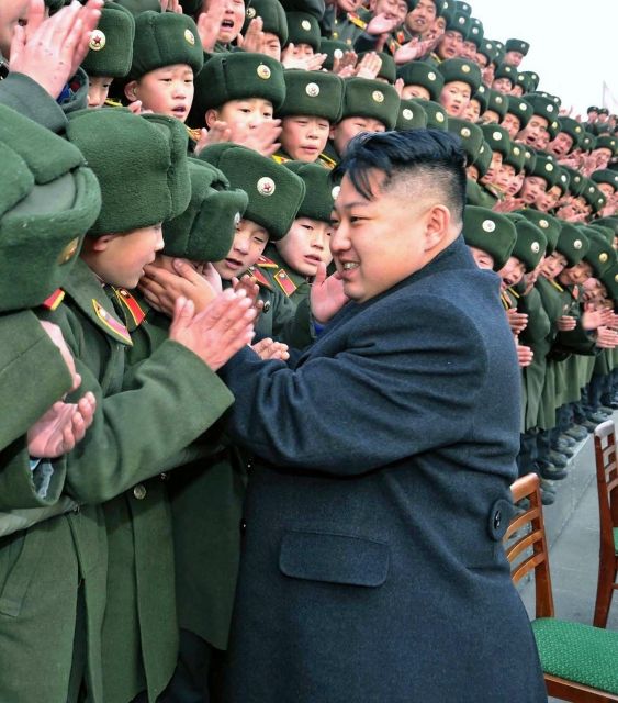 In this undated photo released by the Korean Central News Agency and distributed in Tokyo by the Korea News Service on Jan. 25, 2012, North Korean new leader Kim Jong Un greets students at Mangyongdae Revolutionary School in Pyongyang, North Korea, on the occasion of Chinese New Year. Young Kim gets rock star treatment when he visits his troops, just as his father did. But while the late Kim Jong Il mostly stayed aloof in dark shades, his son holds hands and hugs. He seems to want to bond. (AP Photo/Korean Central News Agency via Korea News Service) JAPAN OUT UNTIL 14 DAYS AFTER THE DAY OF TRANSMISSION =@= | Foto: ČTK