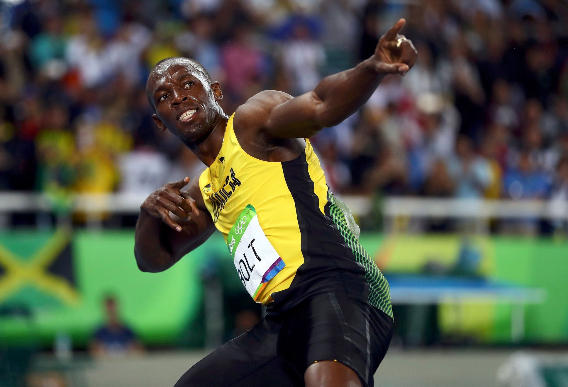 Bolt applies his trademark winning gesture