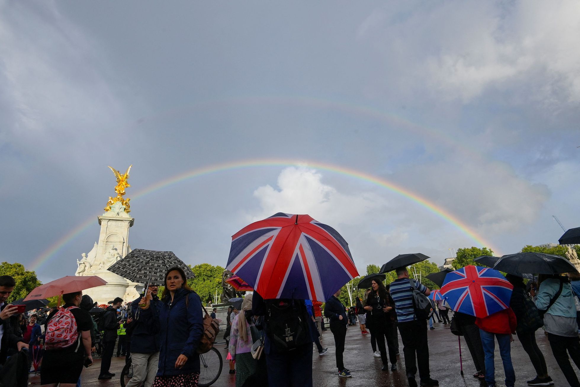 Picture: the queen greets herself with a double rainbow.  Men and women in London shouted praise to Charles