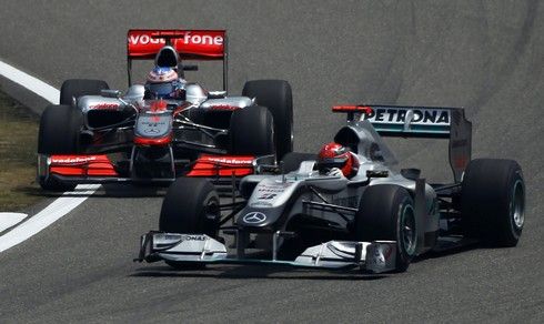 Michael Schumacher a Jenson Button | Foto: Sport