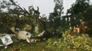 An auto repair building is damaged as a large tree, brought down by the force of Tropical Storm Debby in Medart, Florida, June 25, 2012. Tropical Storm Debby dumped heavy rain over parts of Florida on Monday as it idled in the northern Gulf of Mexico, threatening to bring flooding and tornadoes. REUTERS/Phil Sears (UNITED STATES - Tags: ENVIRONMENT TPX IMAGES OF THE DAY) Published: Čer. 25, 2012, 9:36 odp.