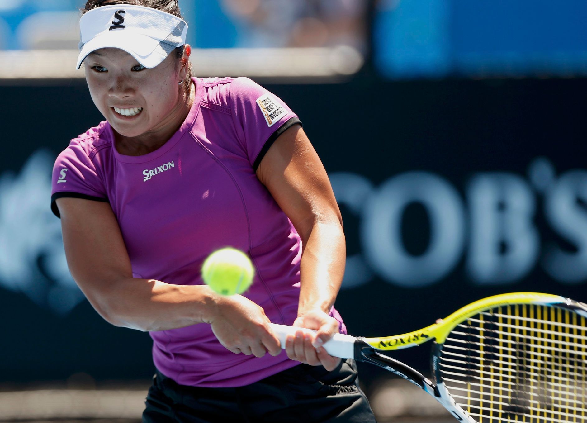 Kurumi Nara of Japan hits a return to Peng Shuai of China during their women's singles match at the Australian Open 2014 tennis tournament in Melbourne