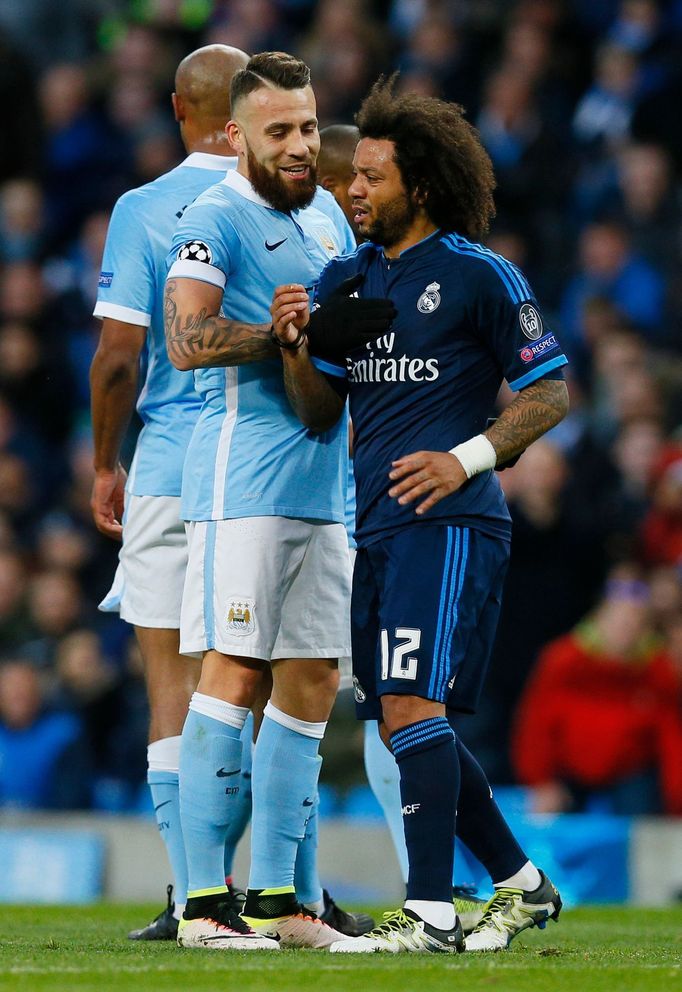 Real Madrid's Marcelo with Manchester City's Nicolas Otamendi