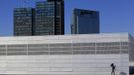 RNPS IMAGES OF THE YEAR 2012 - A woman carries her child on the roof of the Opera House in Oslo, Norway June 20, 2012. In Oslo, the economy has been untouched by the recession and it is a vibrant city with people still spending on everything from housing to consumer goods. Like Dublin ten years ago, there are major building projects underway with luxury apartments being constructed on the waterfront. Ireland now, by contrast, is in a much worse place. The country suffered one of the deepest recessions in Europe after years of reckless decisions made by the country's banks and policymakers brought about a financial crisis that eventually led to Dublin seeking an 85 billion euro ($104 billion) EU/IMF bailout in November 2010. REUTERS/Cathal McNaughton (NORWAY - Tags: BUSINESS CITYSPACE POLITICS SOCIETY) Published: Pro. 4, 2012, 1:03 dop.