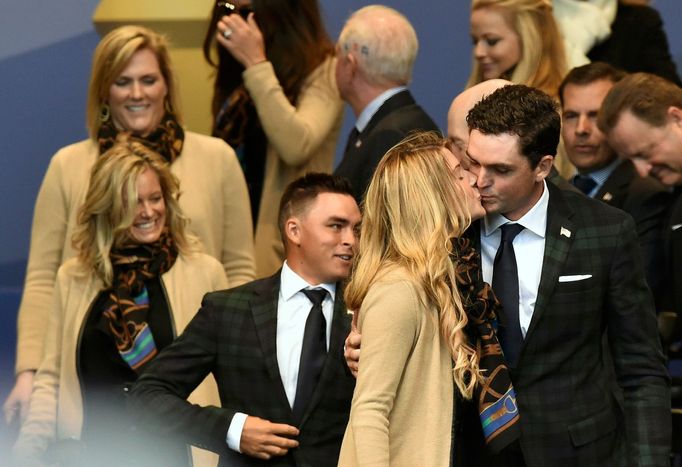 U.S. Team player Keegan Bradley kisses his partner Jillian Stacey during the opening ceremony of the 40th Ryder Cup at Gleneagles