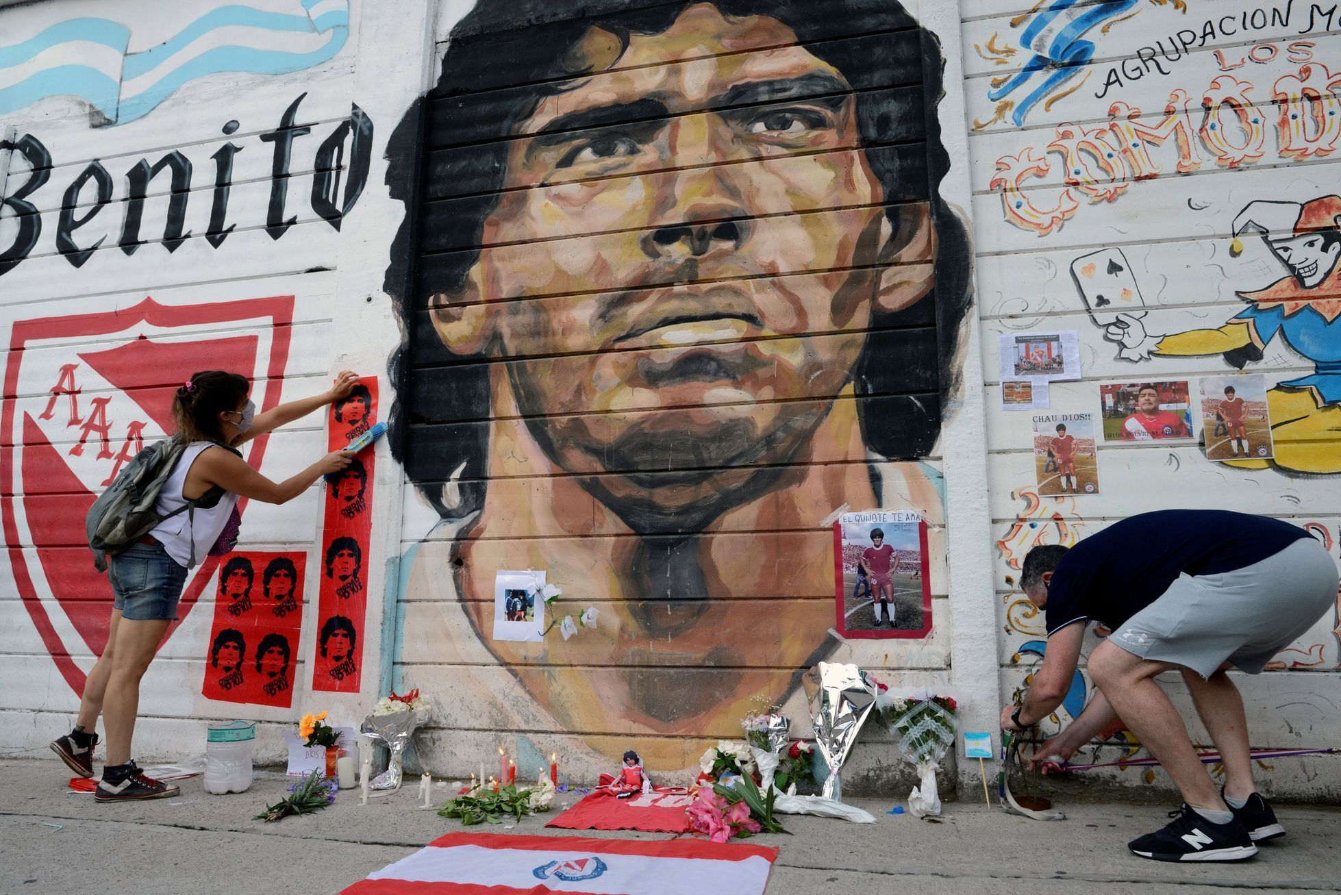 People gather to mourn the death of soccer legend Diego Maradona, outside the Diego Amrando Maradona stadium, in Buenos Aires