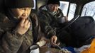 Lumberjacks Alexey Egorov, 45, (L) and Semion VInokurov, 53, lunch in the cabin of their truck in forest outside Tomtor in the Oymyakon valley, in the Republic of Sakha, northeast Russia, January 29, 2013. The coldest temperatures in the northern hemisphere have been recorded in the Oymyakon valley, where according to the United Kingdom Met Office a temperature of -67.8 degrees Celsius (-90 degrees Fahrenheit) was registered in 1933. Yet despite the harsh climate, people live in the valley, and the area is equipped with schools, a post office, a bank, and even an airport runway (albeit open only in the summer). Picture taken January 29, 2013. REUTERS/Maxim Shemetov (RUSSIA - Tags: SOCIETY TRANSPORT ENVIRONMENT) ATTENTION EDITORS: PICTURE 25 OF 27 FOR PACKAGE 'THE POLE OF COLD' SEARCH 'MAXIM COLD' FOR ALL IMAGES Published: Úno. 18, 2013, 11:29 dop.