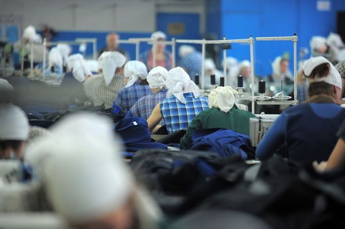 Ivanovo Region prison colony for convicted women IVANOVO REGION, RUSSIA. APRIL 25, 2012. A prison guard and convicted women at work in the sewing room at Women's Prison Colony No3 of the Ivanovo Region branch of the Russian Federal Service of Execution of Sentences (UFSIN) pose for photographs during a fashion show.