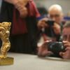 Media take pictures of Golden Bear for Best Film awarded to Iranian film director Panahi during news conference following 65th Berlinale International Film Festival in Berlin