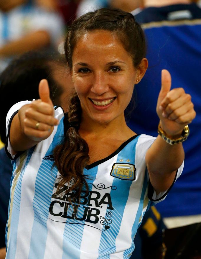 An Argentina supporter poses for a picture before the 2014 World Cup Group F soccer match between Argentina and Bosnia and Herzegovina at the Maracana stadium in Rio de J